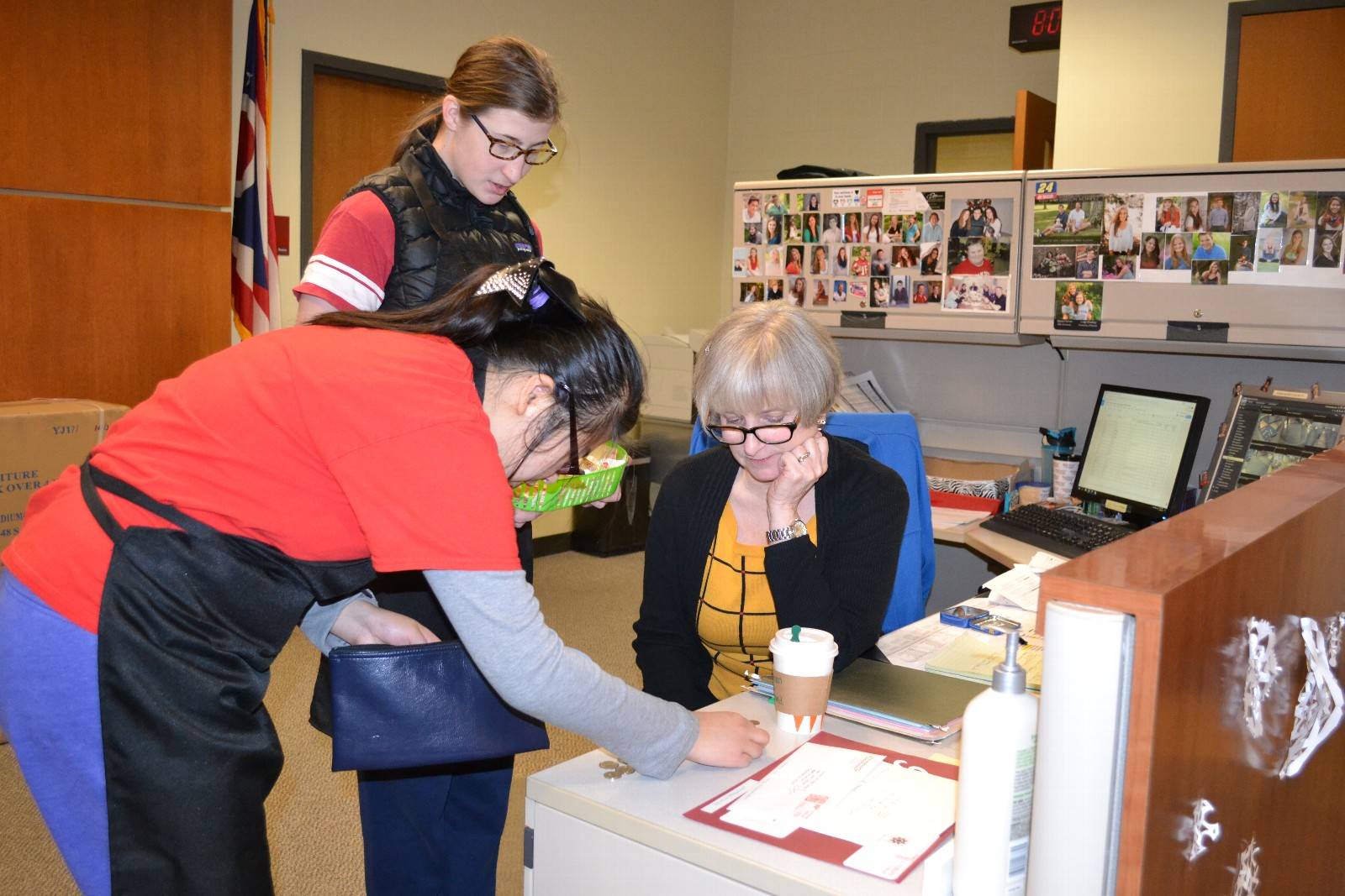 Counting change for Mrs. Frickman in the front office