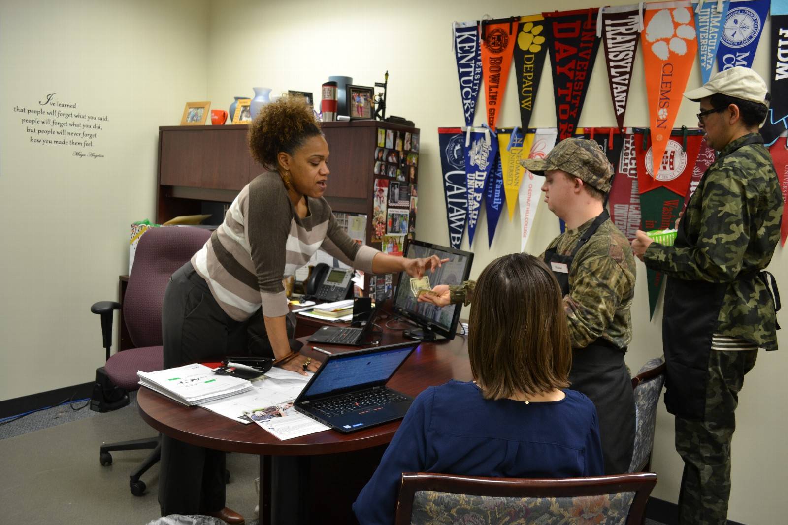 Students collect money and make change for Mrs. Jackson in the Counseling Department.